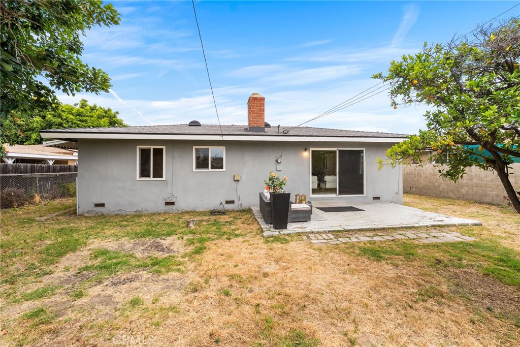 13361 Roxey Drive Garden Grove, CA 92843 - Photo 23 of 31 a view of a house with patio and wooden fence