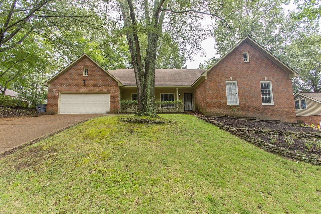 124 South Walnut Bend Road Memphis, TN 38018 - Photo 1 of 22 a front view of house with yard and trees