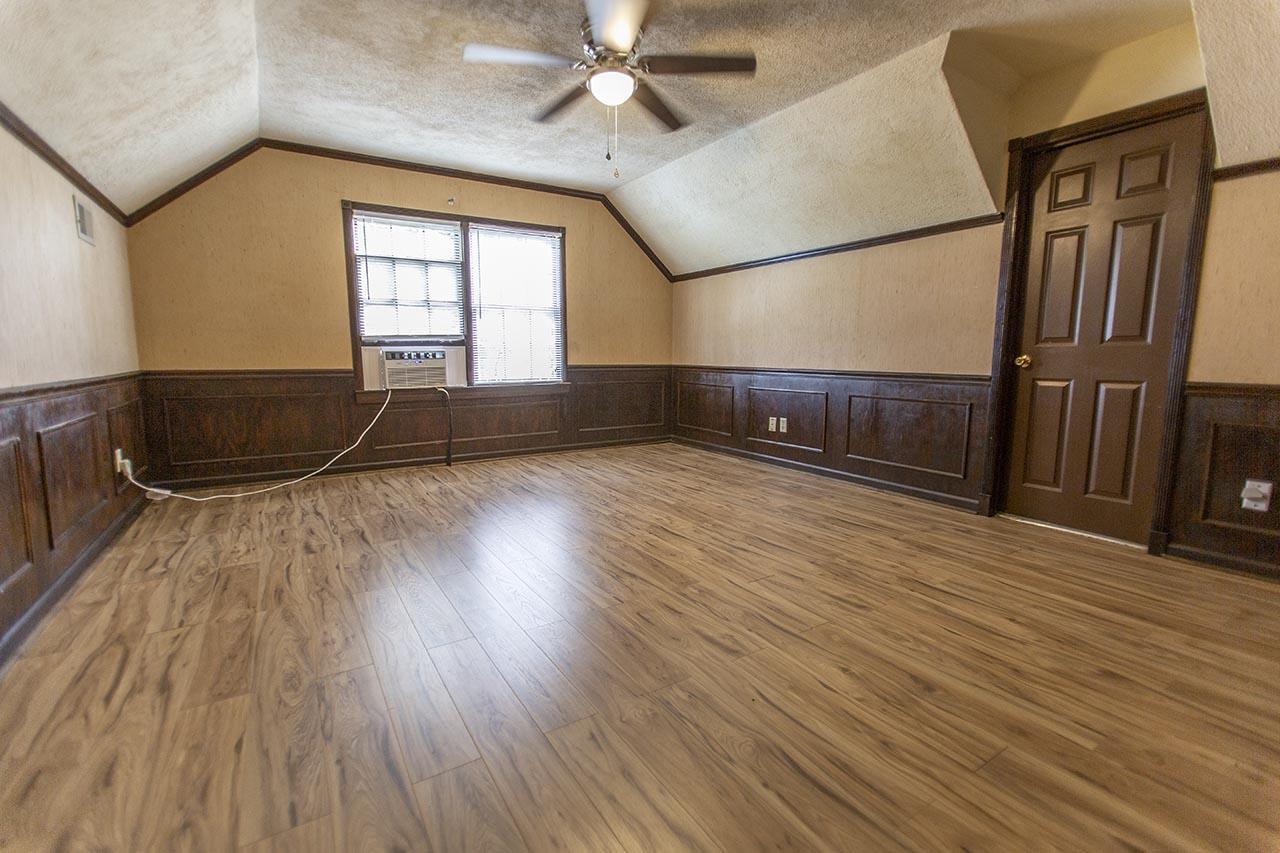 124 South Walnut Bend Road Memphis, TN 38018 - Photo 14 of 22 wooden floor in an empty room with a window
