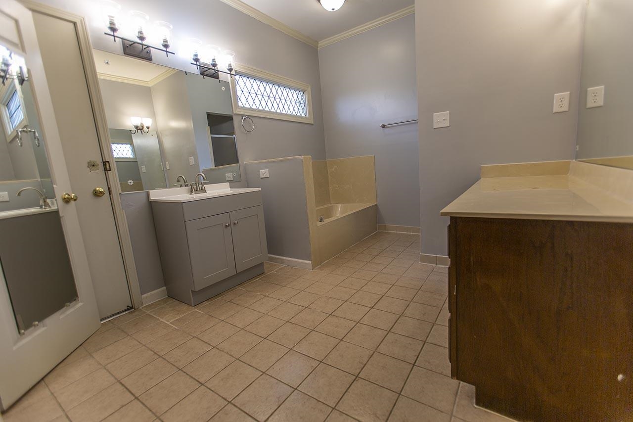 124 South Walnut Bend Road Memphis, TN 38018 - Photo 8 of 22 a bathroom with a sink a vanity and a mirror