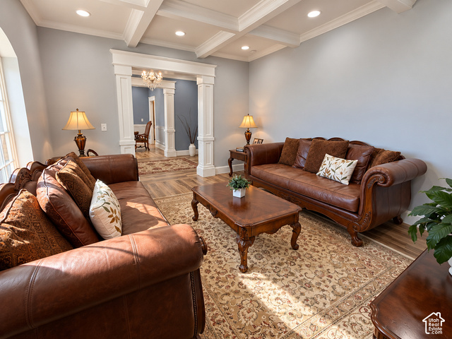 1750 West 4100 North Helper, UT 84526 - Photo 16 of 50 Elegant formal living spaces showcasing rich leather furnishings, coffered ceiling with recessed lighting, and decorative wood-finish flooring throughout