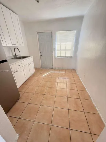 a view of a livingroom with an empty space and window
