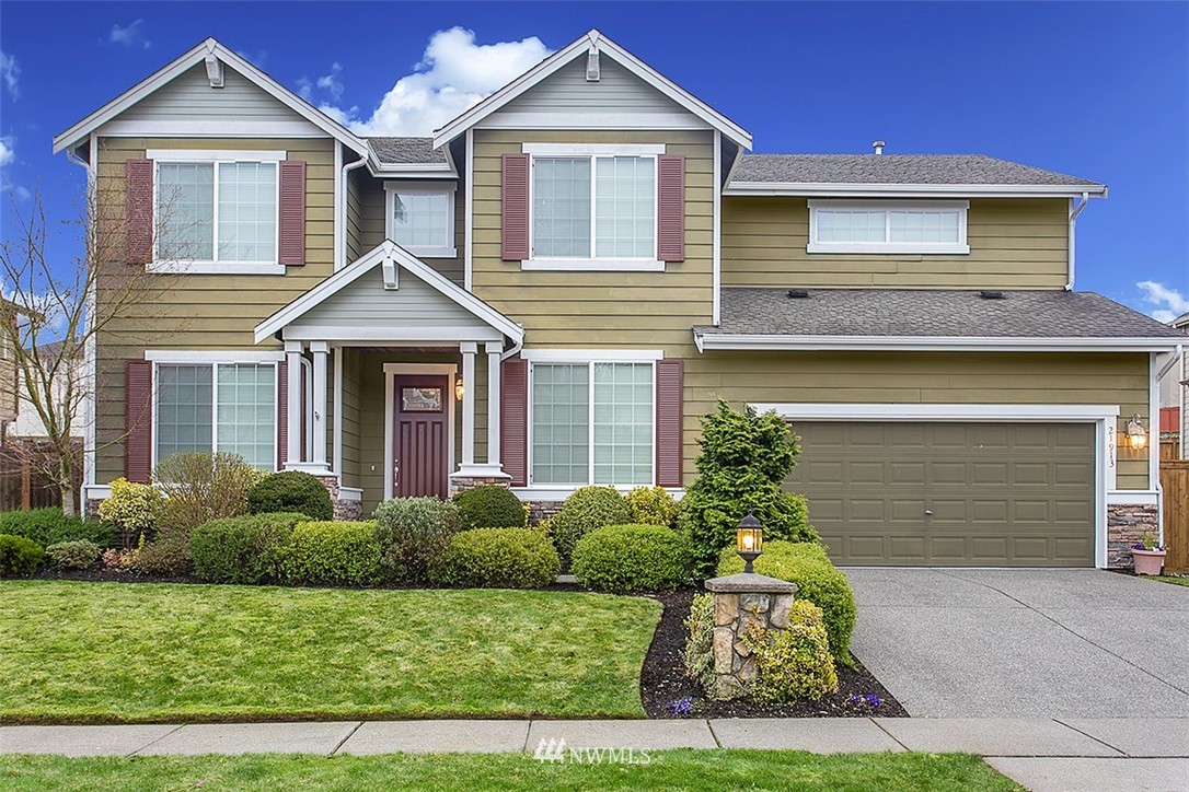 21913 42 Avenue Southeast Bothell, WA 98021 - Photo 1 of 24 a front view of a house with a yard