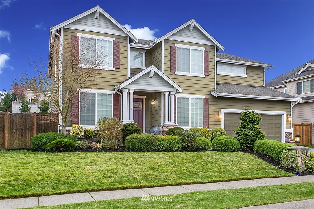 21913 42 Avenue Southeast Bothell, WA 98021 - Photo 2 of 24 a front view of a house with a yard
