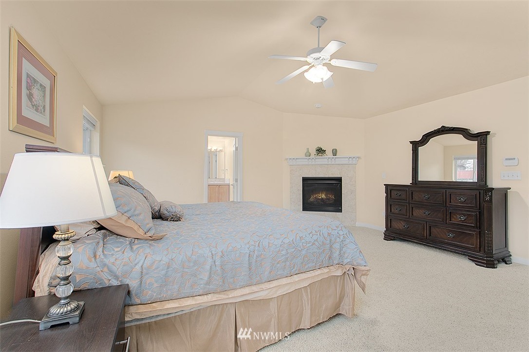 21913 42 Avenue Southeast Bothell, WA 98021 - Photo 13 of 24 a bedroom with a bed and a dresser