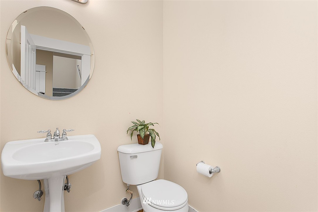 21913 42 Avenue Southeast Bothell, WA 98021 - Photo 20 of 24 a bathroom with a toilet a sink and mirror