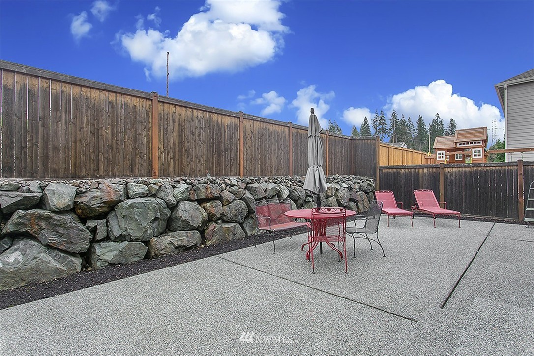 21913 42 Avenue Southeast Bothell, WA 98021 - Photo 23 of 24 a view of a couches and dinning table and chairs in the patio