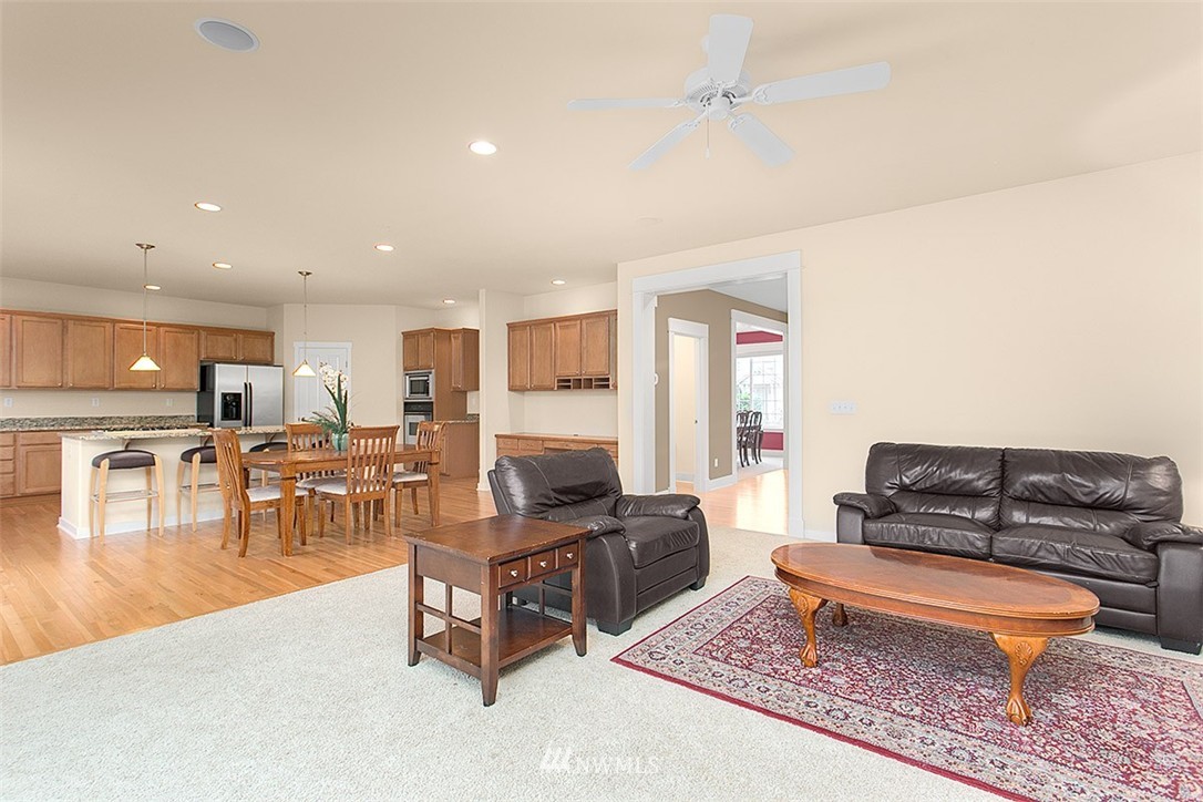 21913 42 Avenue Southeast Bothell, WA 98021 - Photo 5 of 24 a living room with furniture and a table