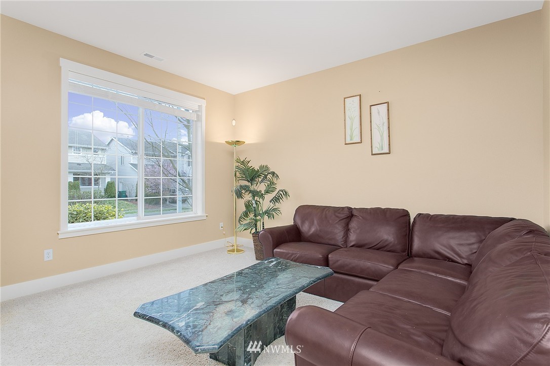 21913 42 Avenue Southeast Bothell, WA 98021 - Photo 9 of 24 a living room with furniture and a couch
