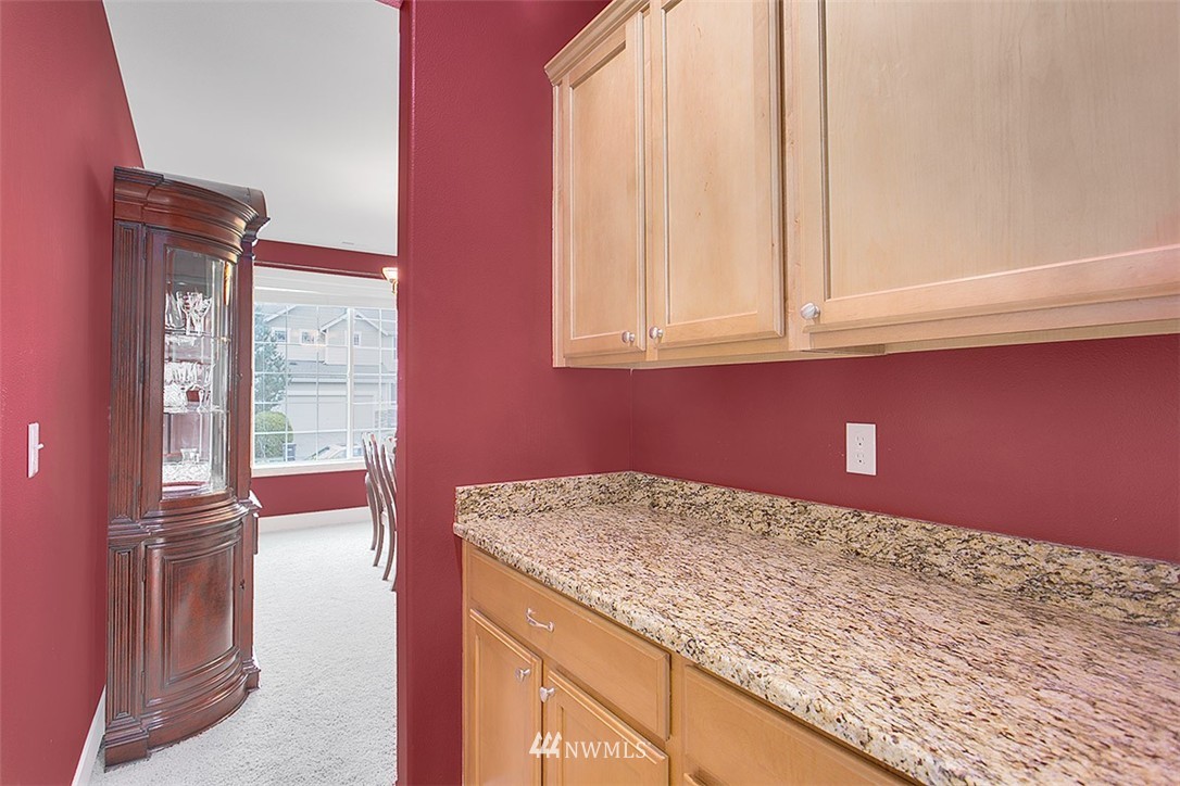 21913 42 Avenue Southeast Bothell, WA 98021 - Photo 10 of 24 a bathroom with a granite countertop sink and dishwasher