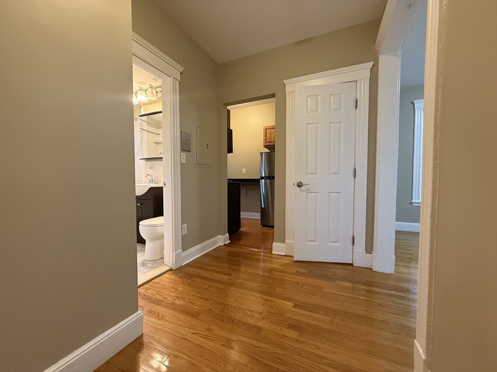 660 Huntington Avenue, Unit 18 Boston, MA 02115 - Photo 1 of 23 a view of a room with wooden floor and bathroom view