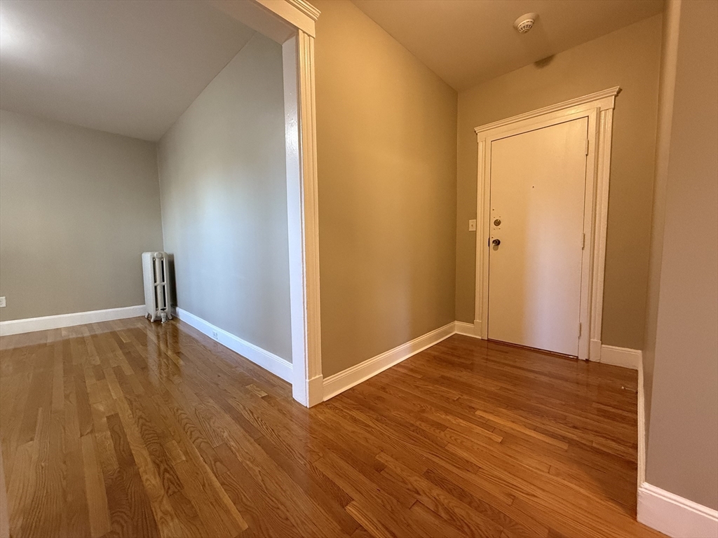 660 Huntington Avenue, Unit 18 Boston, MA 02115 - Photo 6 of 23 a view of empty room with wooden floor