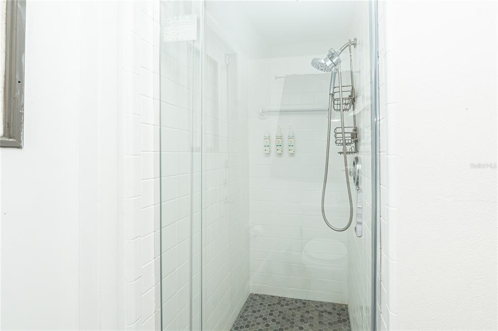 7720 Indian Ridge Trail South Kissimmee, FL 34747 - Photo 15 of 35 a bathroom with a shower