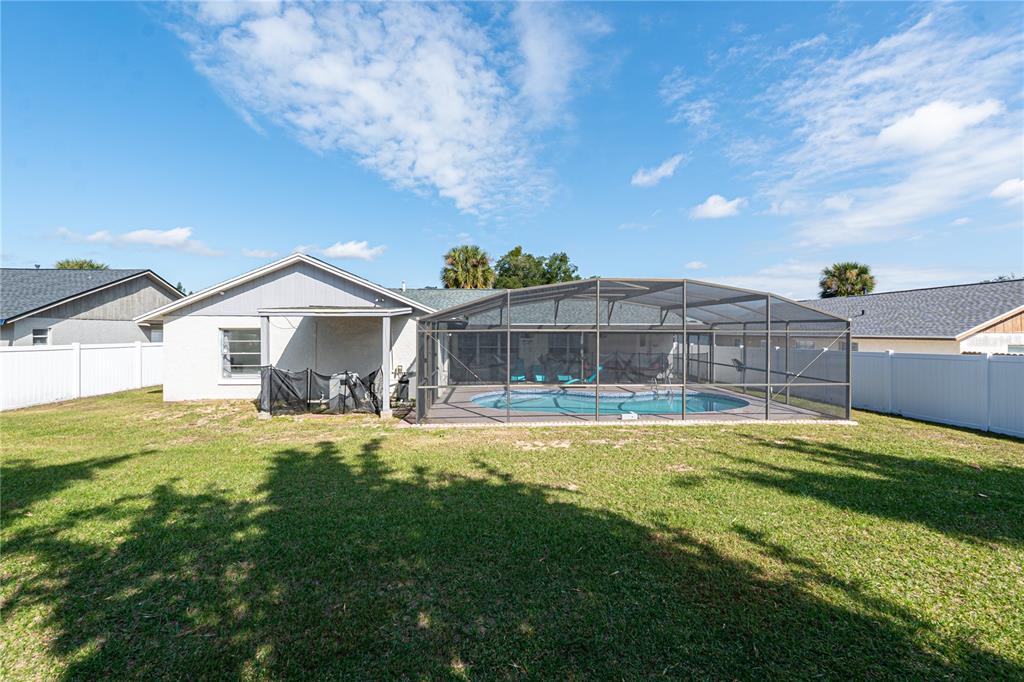 7720 Indian Ridge Trail South Kissimmee, FL 34747 - Photo 31 of 35 a front view of house with yard and seating