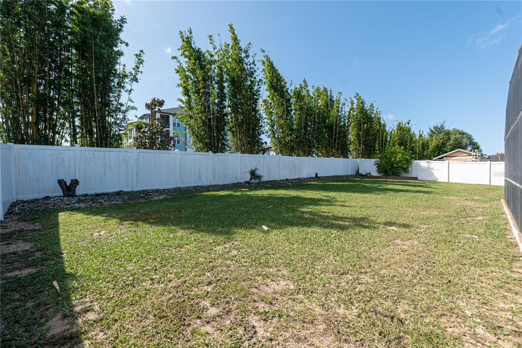 7720 Indian Ridge Trail South Kissimmee, FL 34747 - Photo 32 of 35 a view of a pool with a yard