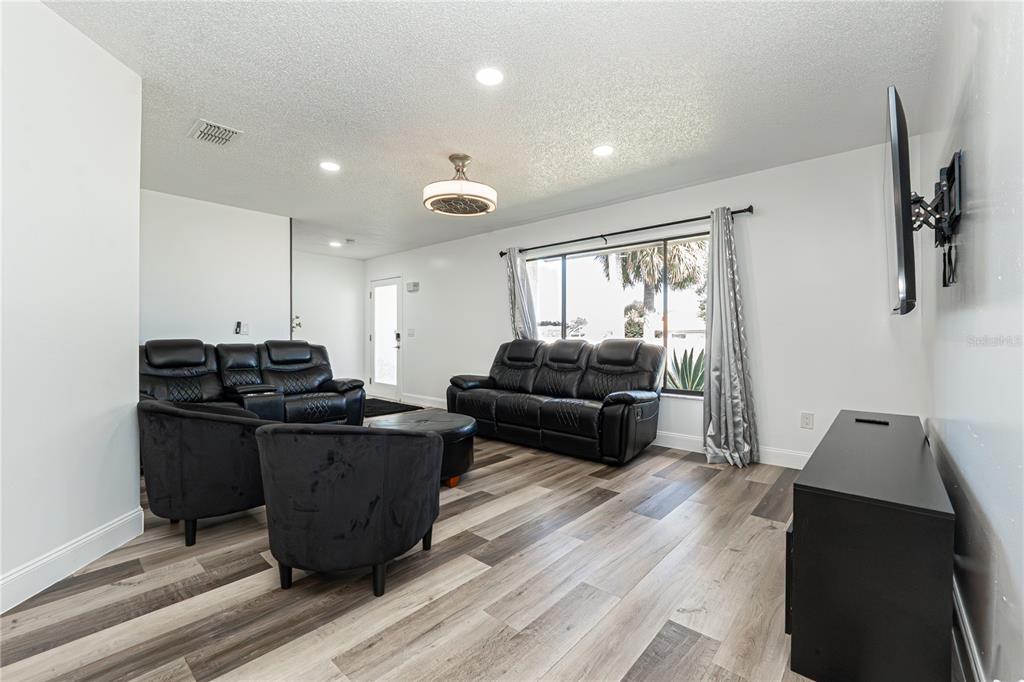 7720 Indian Ridge Trail South Kissimmee, FL 34747 - Photo 9 of 35 a living room with furniture and a window