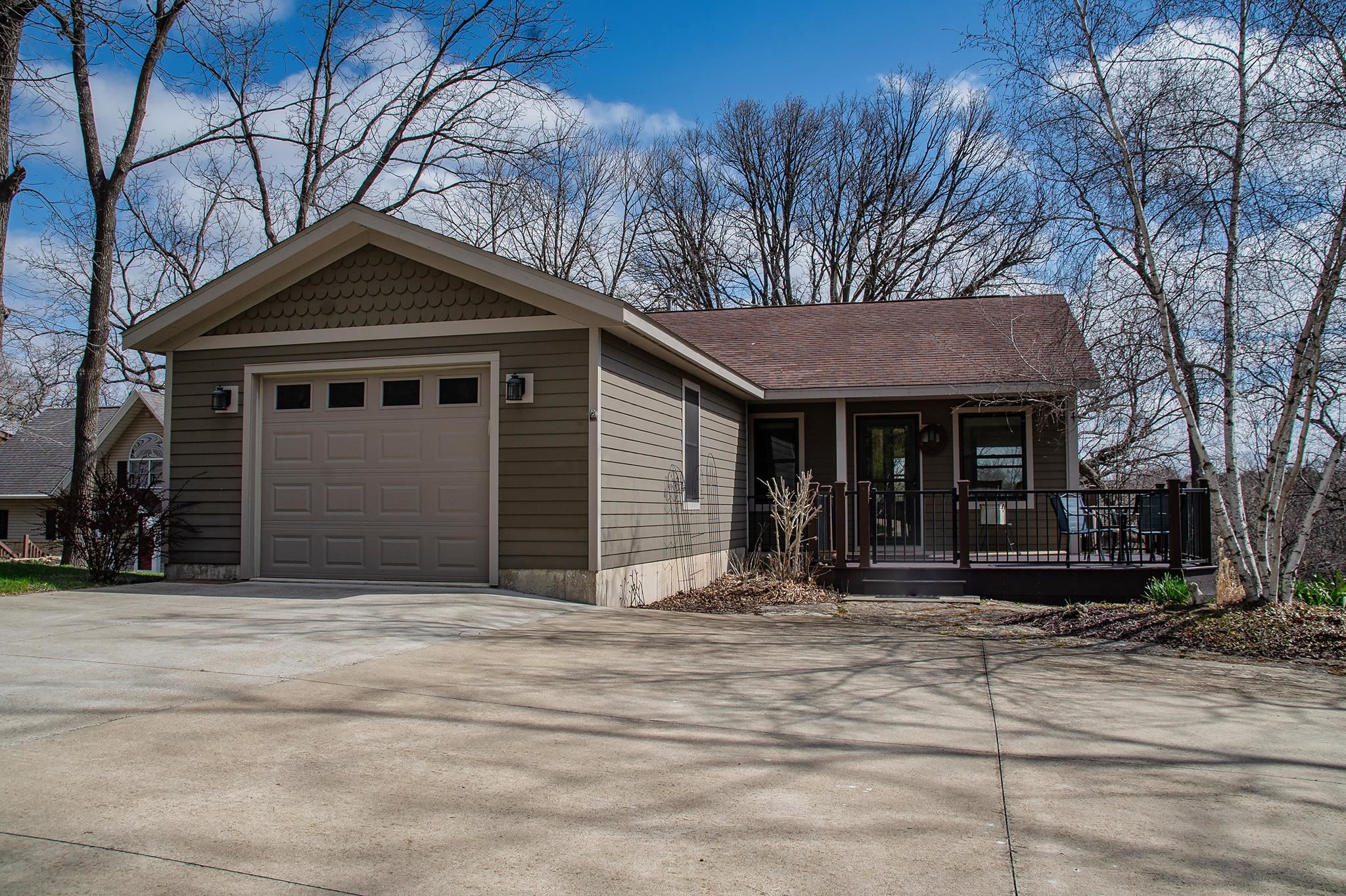 7-a252 Tomahawk Lane Apple River, IL 61001 - Photo 1 of 34 a front view of a house with a yard