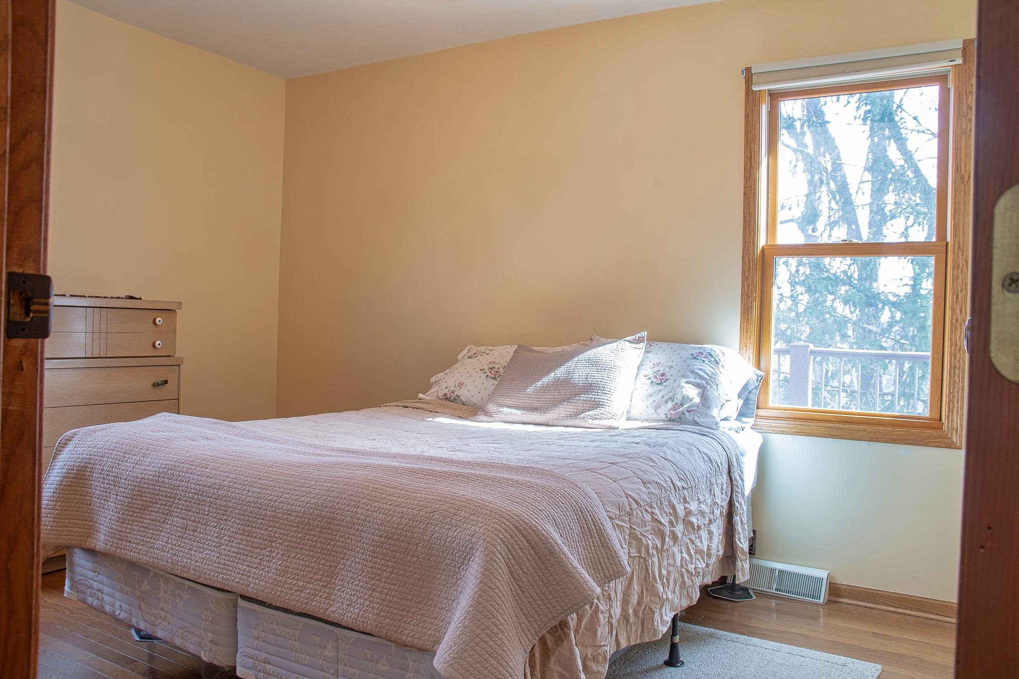 7-a252 Tomahawk Lane Apple River, IL 61001 - Photo 25 of 34 a bedroom with a bed and wooden floor