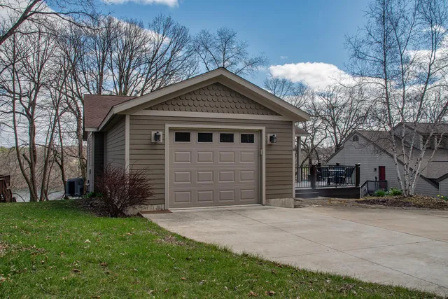 a front view of house with a garden