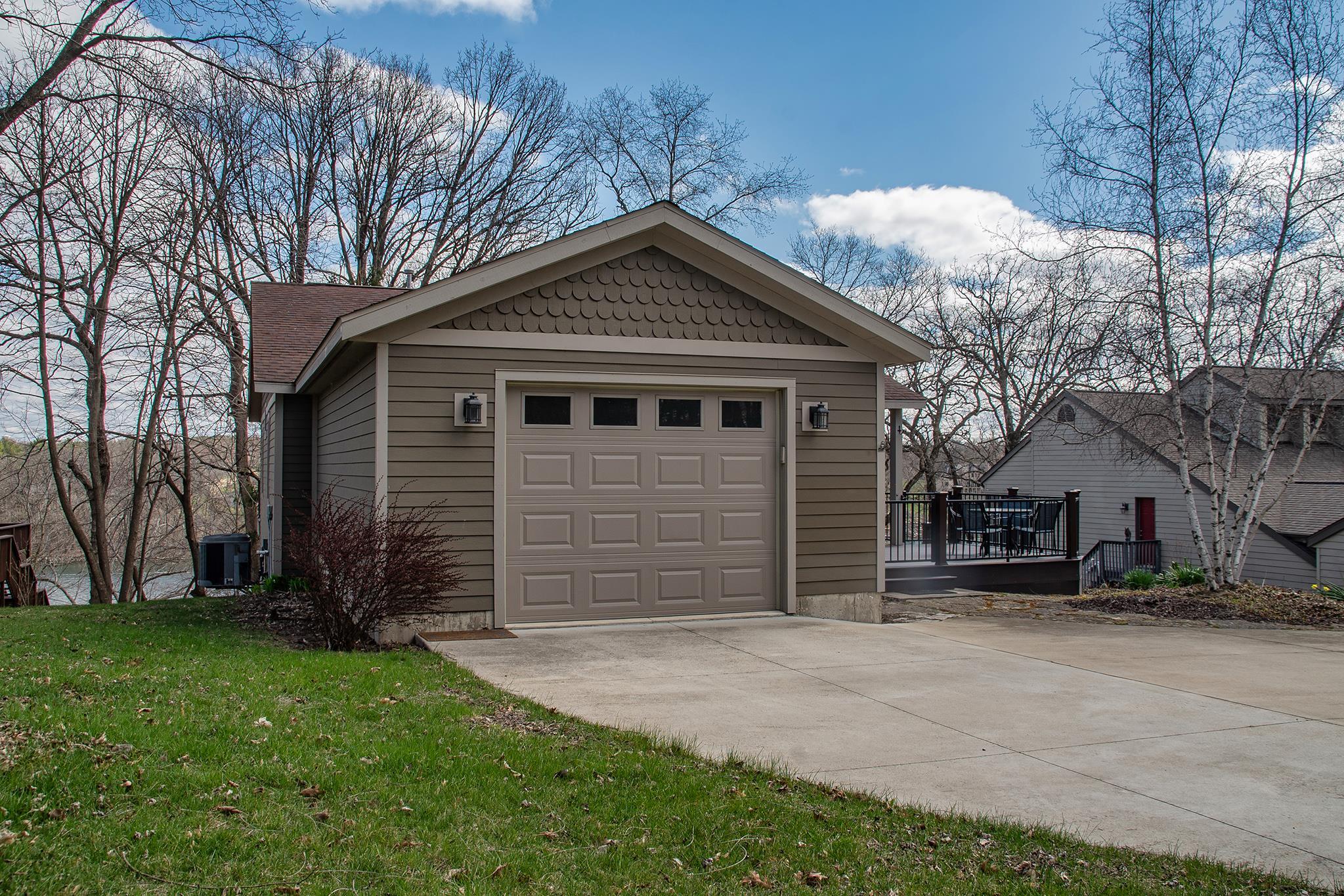 7-a252 Tomahawk Lane Apple River, IL 61001 - Photo 3 of 34 a front view of house with a garden