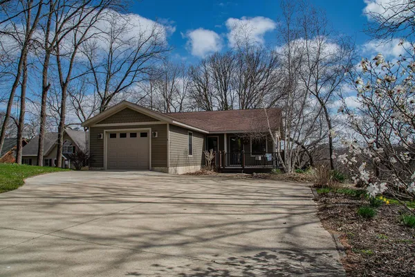 a house with trees in the background