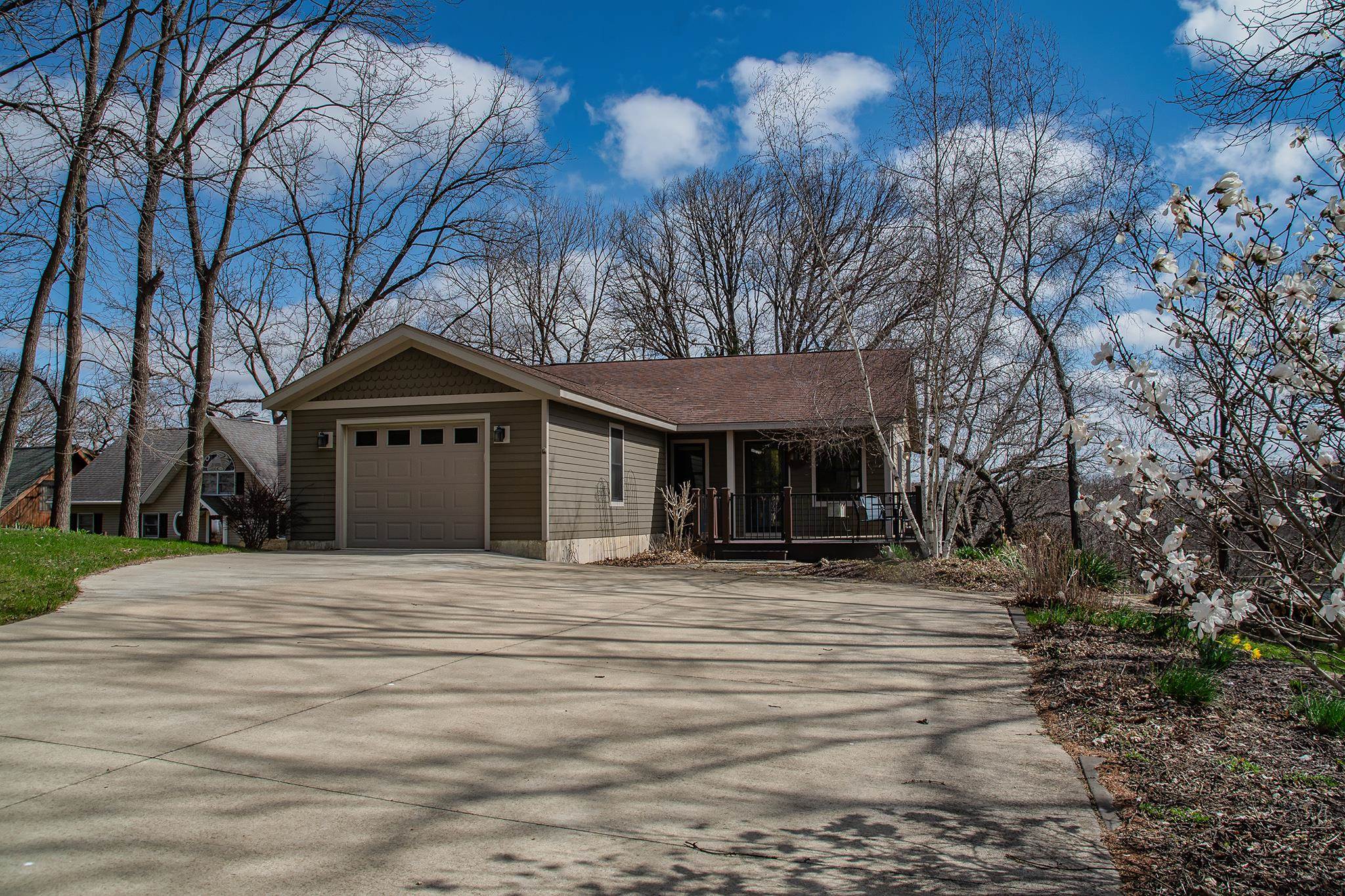 7-a252 Tomahawk Lane Apple River, IL 61001 - Photo 4 of 34 a house with trees in the background