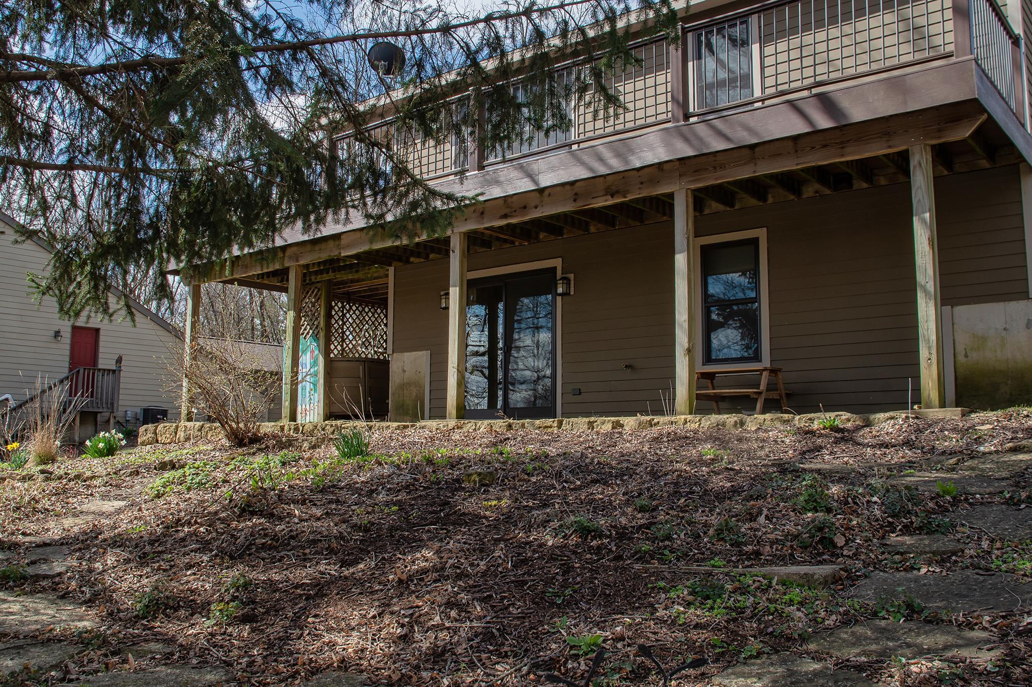 7-a252 Tomahawk Lane Apple River, IL 61001 - Photo 8 of 34 a house with trees in front of it