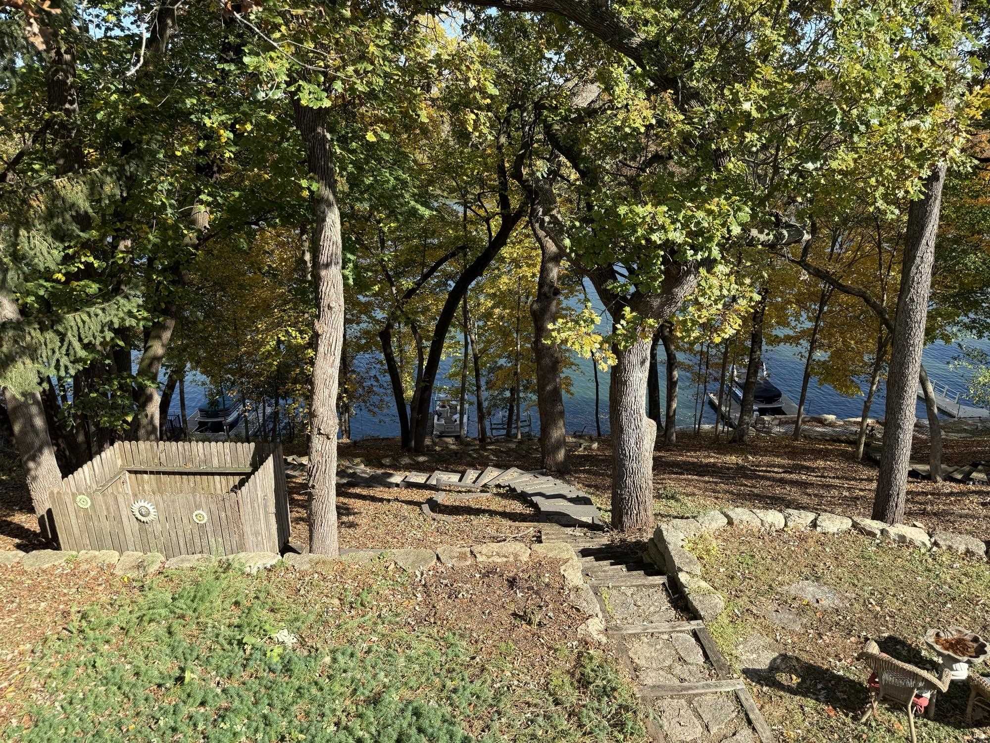 7-a252 Tomahawk Lane Apple River, IL 61001 - Photo 10 of 34 a front view of a house with trees and covered with snow