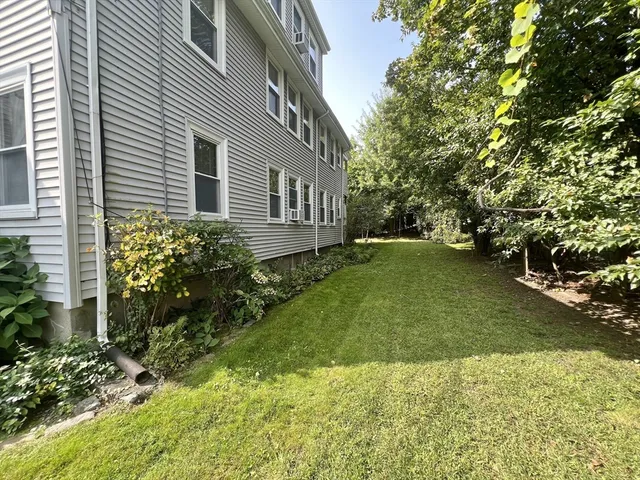 a backyard of a house with lots of green space