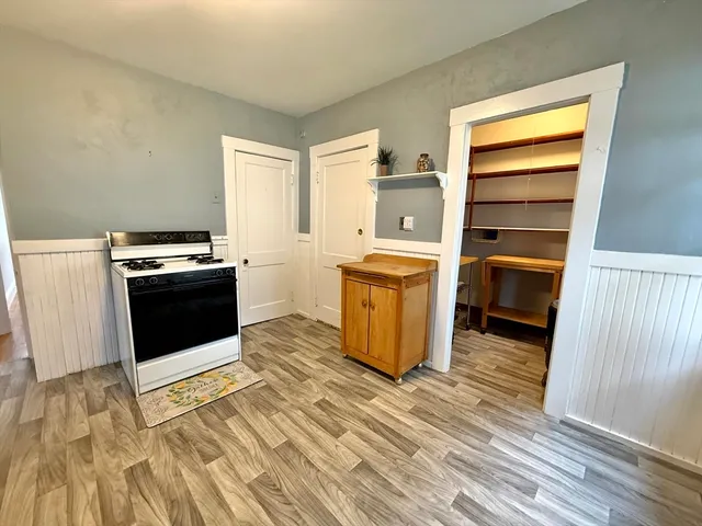 a kitchen with a stove and a microwave