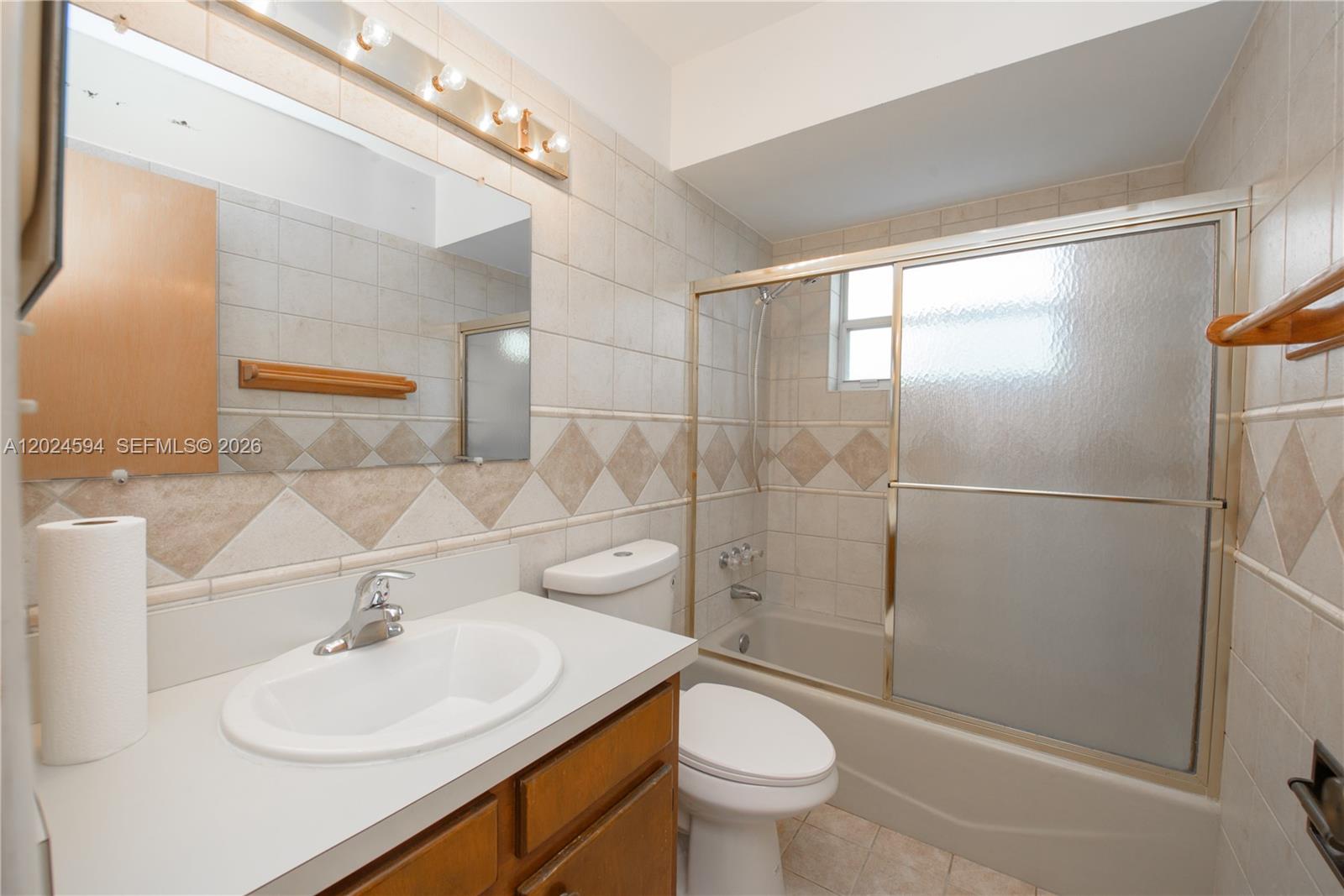 17355 Southwest 256th Street Homestead, FL 33031 - Photo 23 of 32 a bathroom with a sink toilet and shower