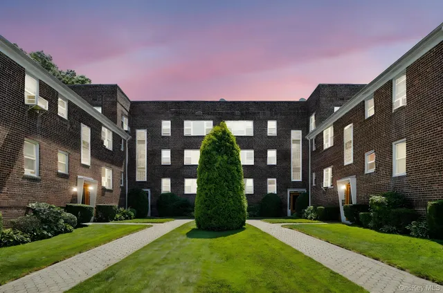 a view of a building with a yard
