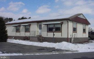 59 Ridgewood Manor Manheim, PA 17545 - Photo 1 of 1 a front view of a house with a yard