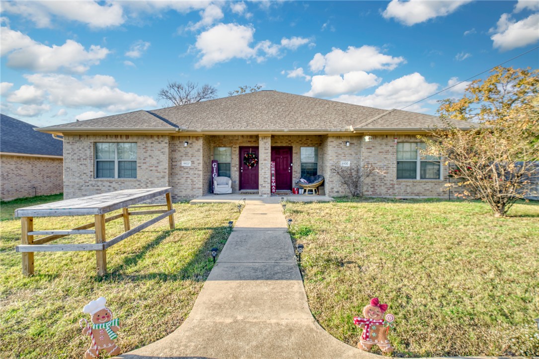 a view of a house with swimming pool and sitting area