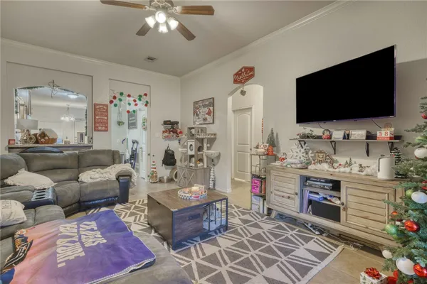 a living room with furniture and a flat screen tv