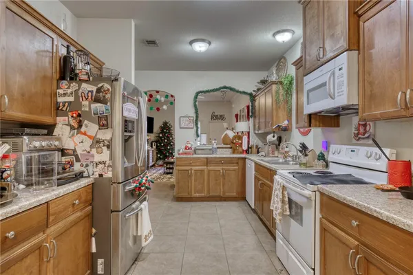a kitchen with stainless steel appliances granite countertop a sink and cabinets