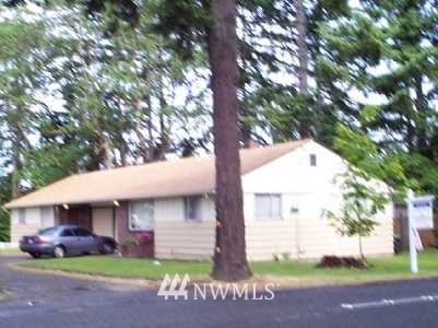 8816 Custer Road Southwest Lakewood, WA 98499 - Photo 1 of 1 a front view of a house with a garden and yard