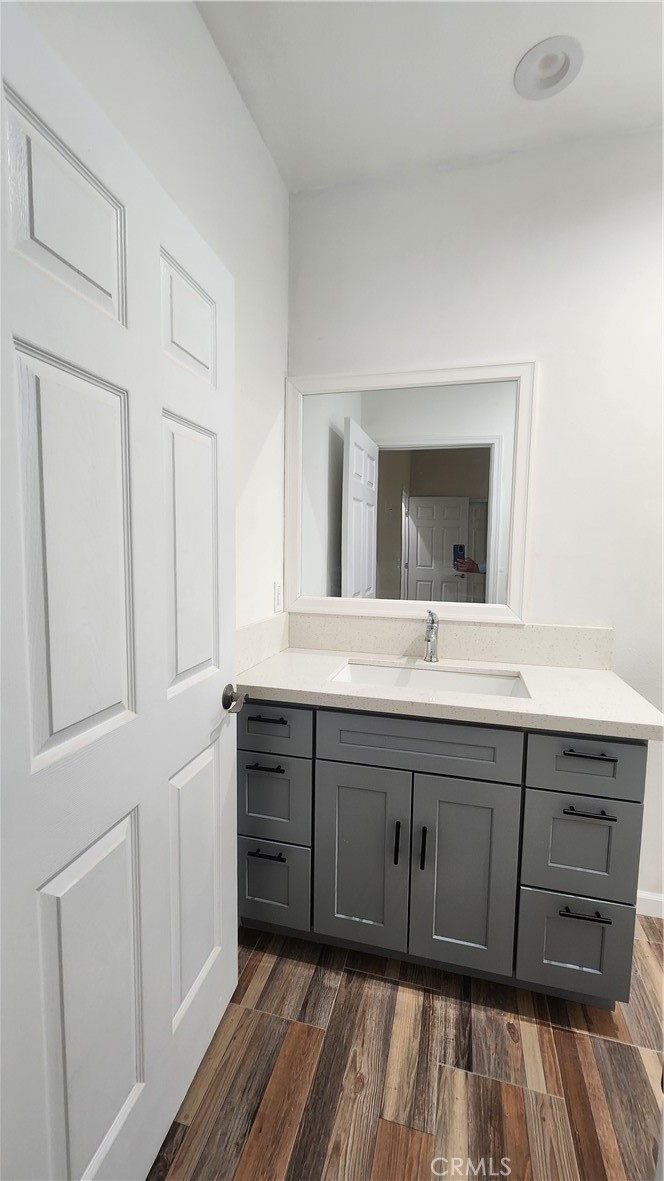 3433 Eucalyptus Avenue Riverside, CA 92507 - Photo 11 of 38 a spacious bathroom with a double vanity sink and a mirror