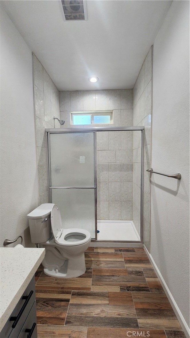 3433 Eucalyptus Avenue Riverside, CA 92507 - Photo 14 of 38 a bathroom with a toilet and a shower
