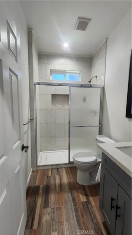 a bathroom with a toilet sink and shower