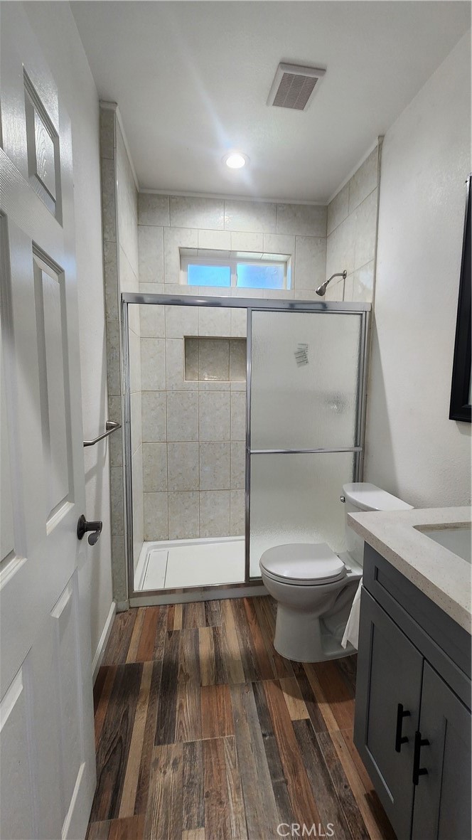 3433 Eucalyptus Avenue Riverside, CA 92507 - Photo 15 of 38 a bathroom with a toilet and a shower