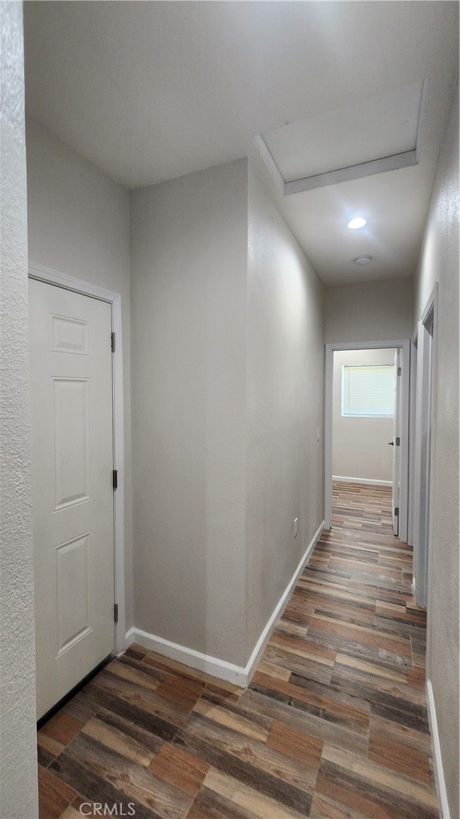 3433 Eucalyptus Avenue Riverside, CA 92507 - Photo 17 of 38 a view of a hallway with wooden floor and closet
