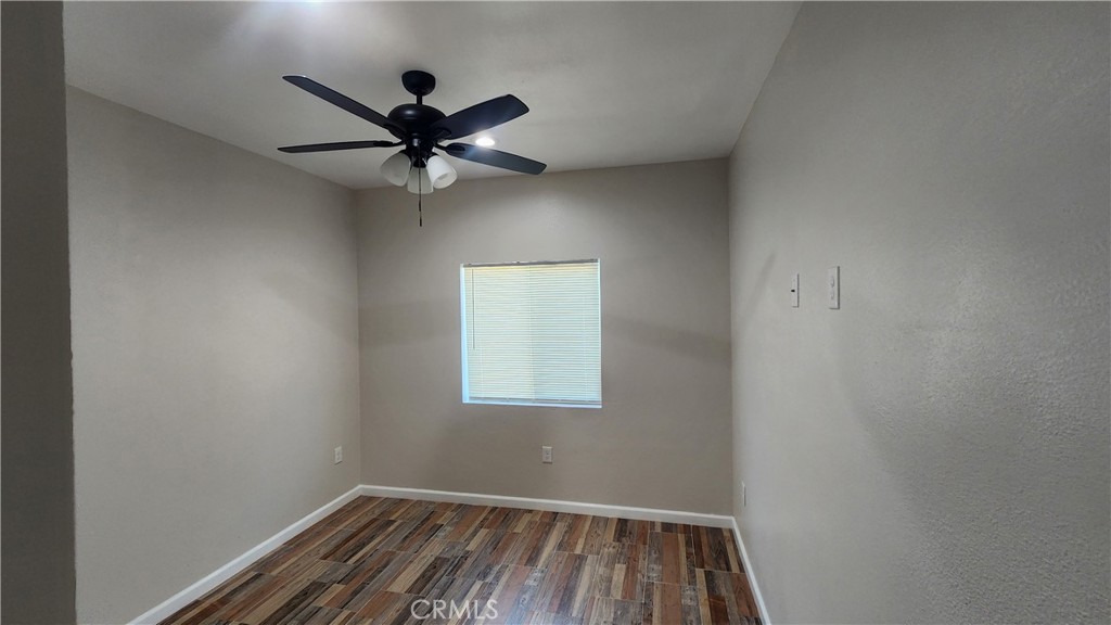 3433 Eucalyptus Avenue Riverside, CA 92507 - Photo 21 of 38 an empty room with a window and a fan