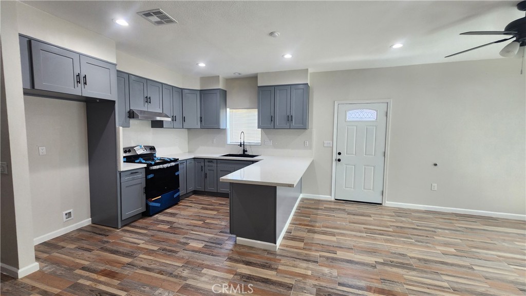 3433 Eucalyptus Avenue Riverside, CA 92507 - Photo 25 of 38 a kitchen with a refrigerator and a stove top oven