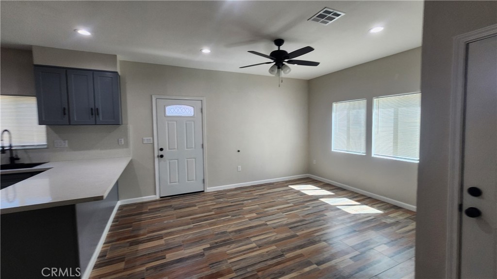 3433 Eucalyptus Avenue Riverside, CA 92507 - Photo 26 of 38 a view of an empty room with a window and wooden floor