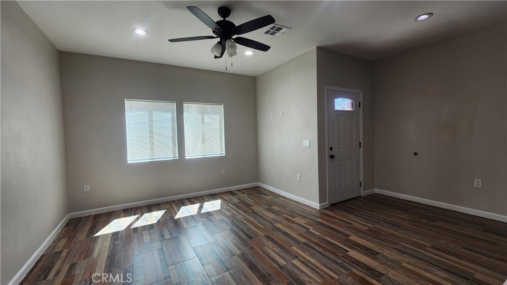 3433 Eucalyptus Avenue Riverside, CA 92507 - Photo 28 of 38 an empty room with wooden floor and windows