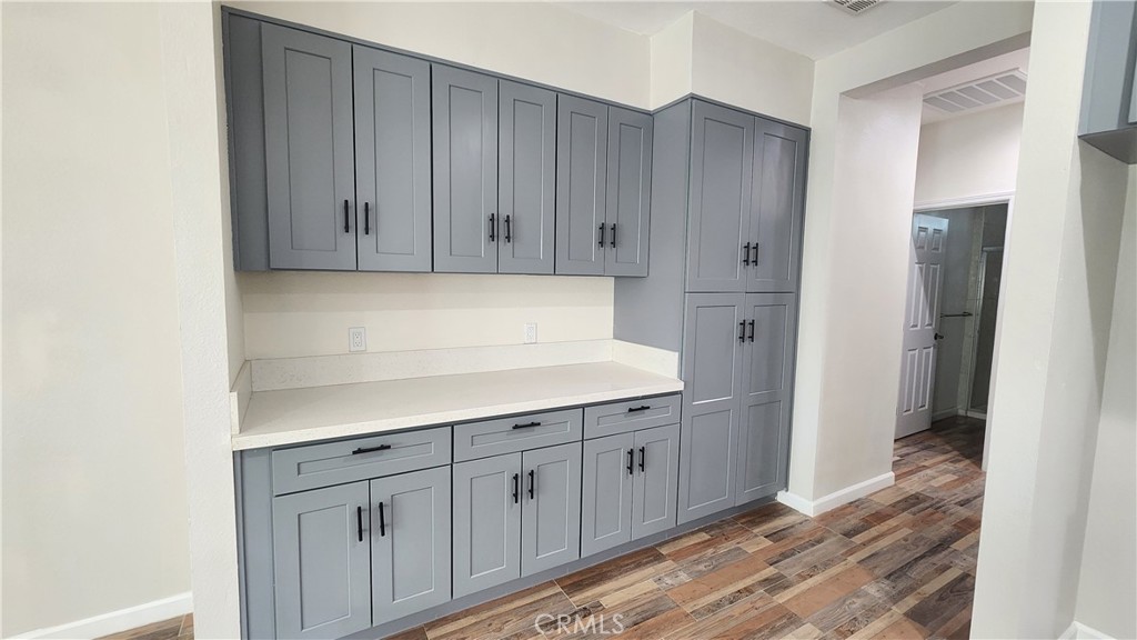 3433 Eucalyptus Avenue Riverside, CA 92507 - Photo 31 of 38 a view of cabinets with wooden floor