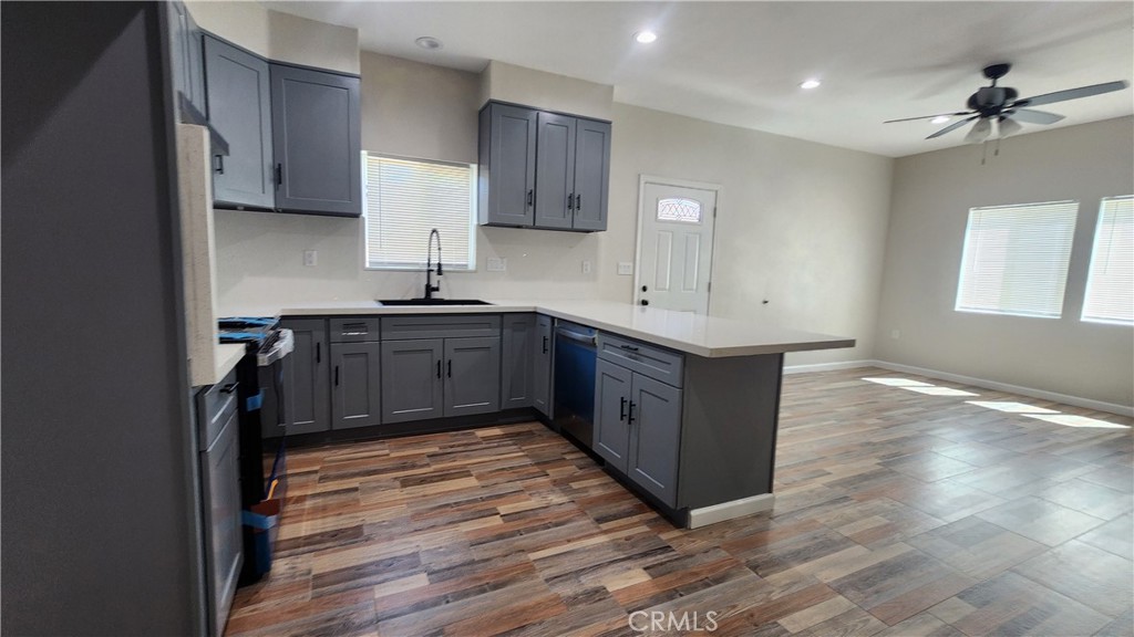 3433 Eucalyptus Avenue Riverside, CA 92507 - Photo 33 of 38 a kitchen with sink cabinets and wooden floor