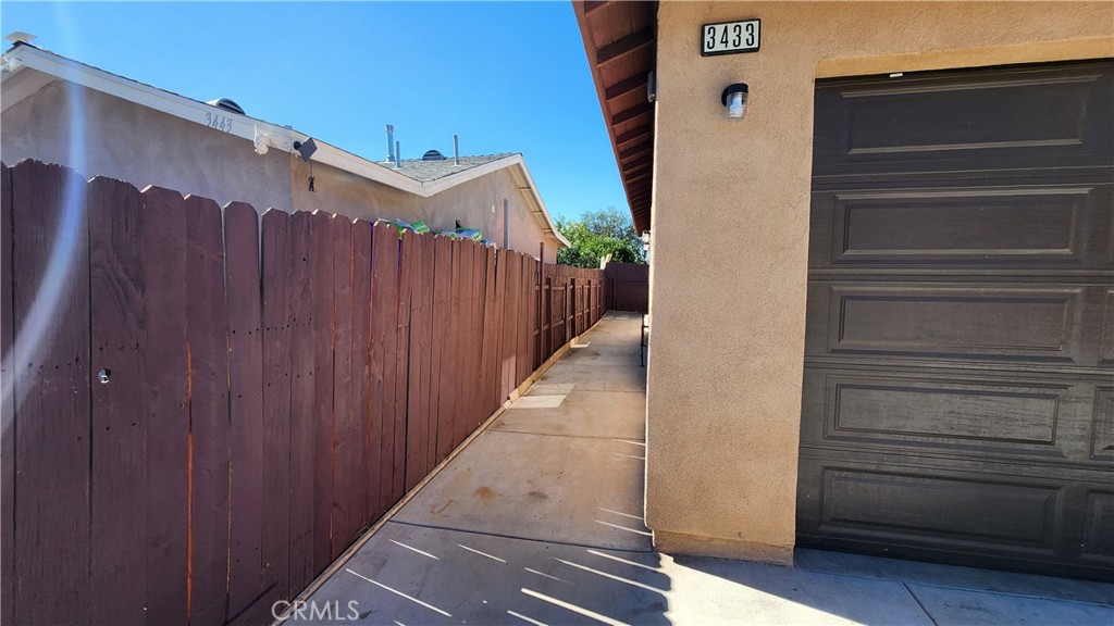 3433 Eucalyptus Avenue Riverside, CA 92507 - Photo 36 of 38 a view of a house with a wooden door
