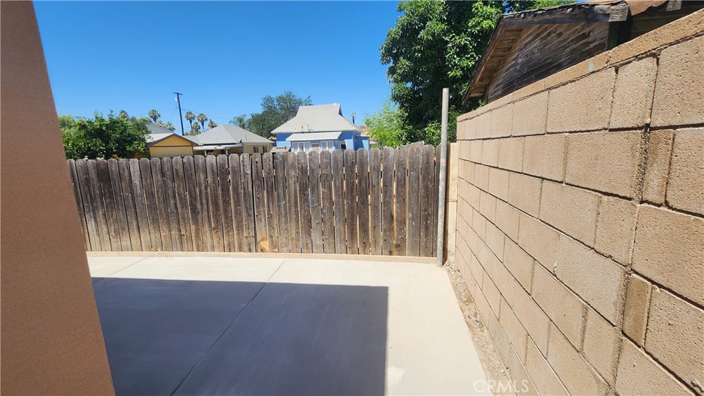 3433 Eucalyptus Avenue Riverside, CA 92507 - Photo 5 of 38 a backyard of a house with wooden floor